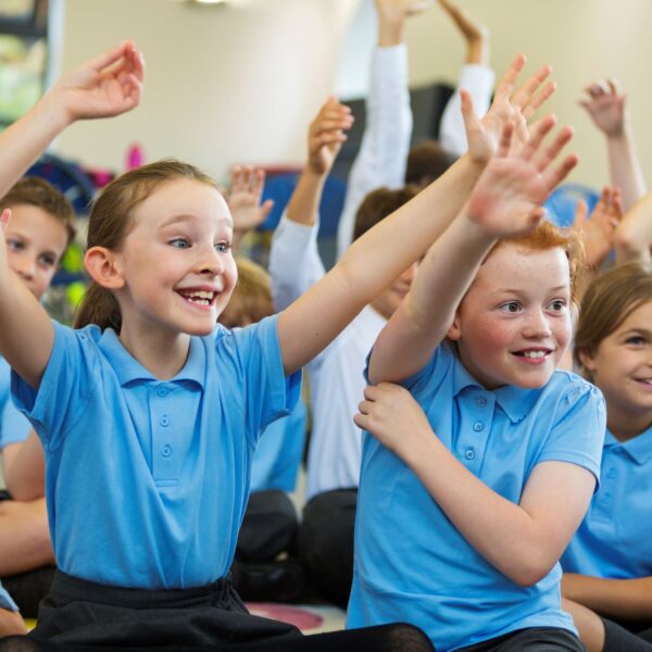 Children in blue school uniforms in the classroom